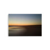 The 'Serenity II' Print features a blurred beach at sunset with a gradient sky from deep blue to warm orange, and soft, dark sand along the peaceful shore.