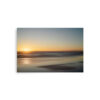 The 'Serenity I' Print features a blurred beach at sunset, with the sun low on the horizon, gentle waves, and a gradient sky shifting from blue to warm orange for a tranquil effect.