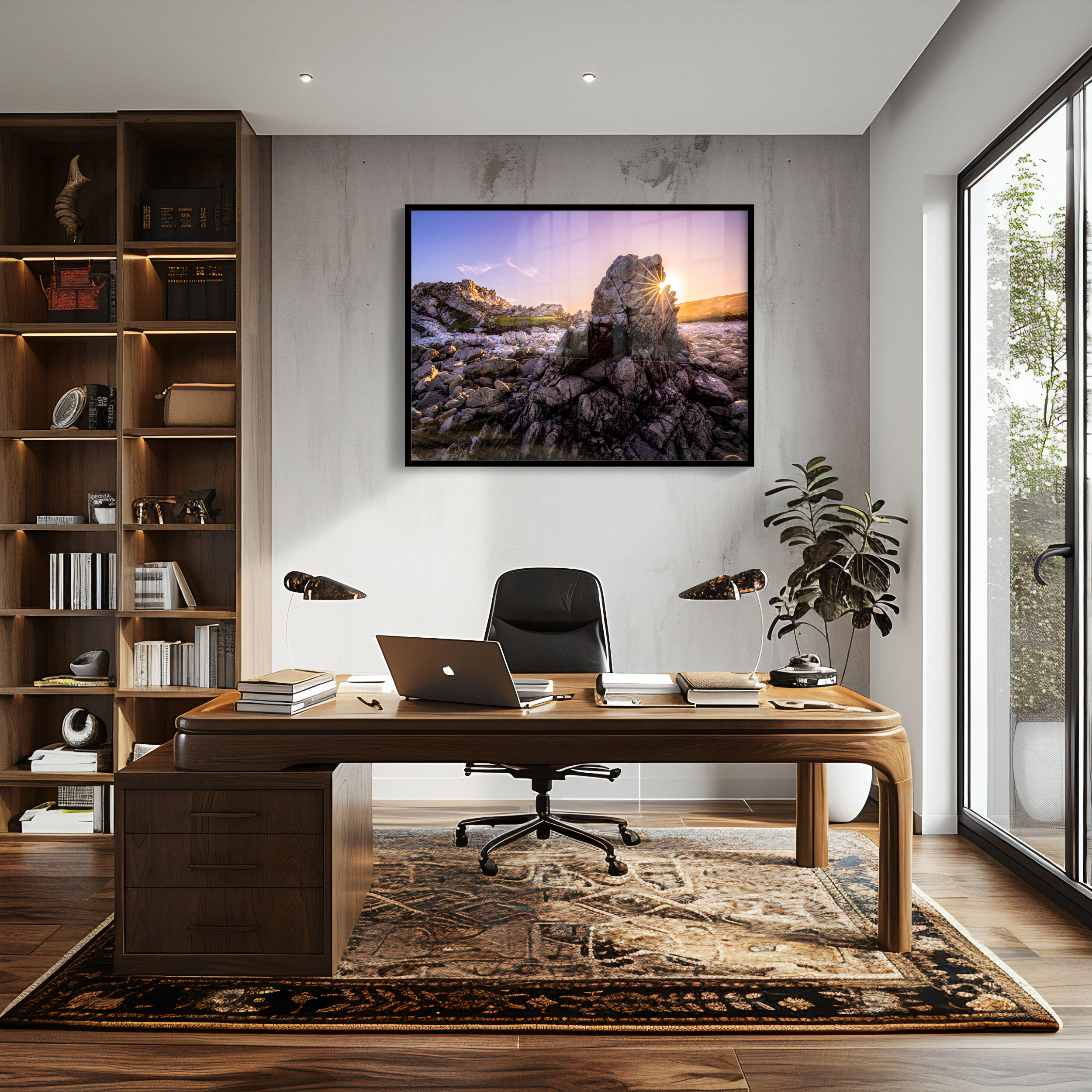 A modern home office with a wooden desk, laptop, books, and black chair on a patterned rug. Shelves line one wall, a plant is by the window, and 'The Sentinel' print hangs above the desk.