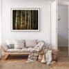 oak-framed image of a forest scene in a neutral tone living room setting