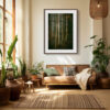A cosy living room with potted plants, a tan sofa, and a large window features the 'Spirits of the Forest' (V) Print above the sofa, adding natural light and tranquil charm to the space.