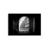 The "Arch of the Citadel" Print features a black-and-white photo of a European street framed by a stone archway, with historic buildings and an illuminated cobbled path beyond the shadowy arch.