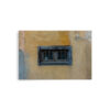 The 'Window of Old Town Bastia' Print features a small rectangular window with black metal bars set in a weathered yellow wall, highlighted by flaking paint and a textured, rustic finish.